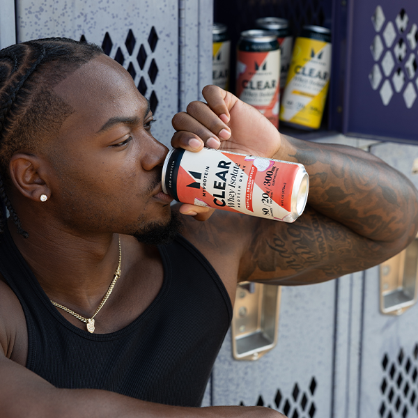 Man Drinking Clear Whey Isolate Protein Drink